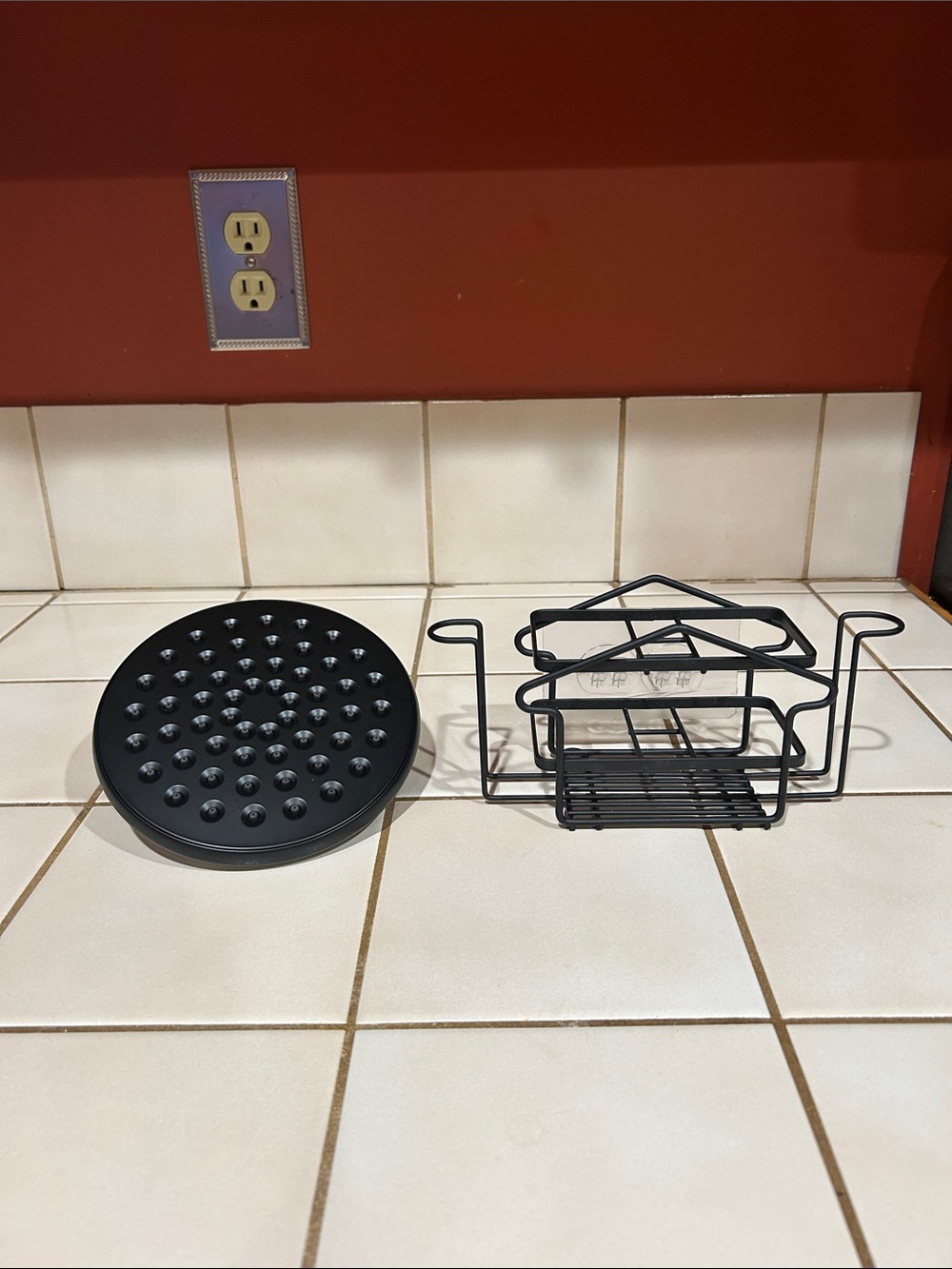 Delta Black Round Shower Head - Universal Fit. Small wall mounted shower caddy